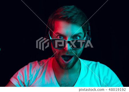 Enjoying his favorite music. 48019192