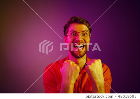 Winning success man happy ecstatic celebrating being a winner. Dynamic energetic image of male model Winning success man happy ecstatic celebrating being a winner. Dynamic energetic image of male model 48019595