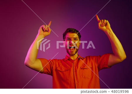 Winning success man happy ecstatic celebrating being a winner. Dynamic energetic image of male model Winning success man happy ecstatic celebrating being a winner. Dynamic energetic image of male model 48019596