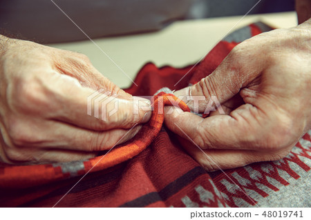 Tailor man working in his tailor shop, Tailoring, close up 48019741