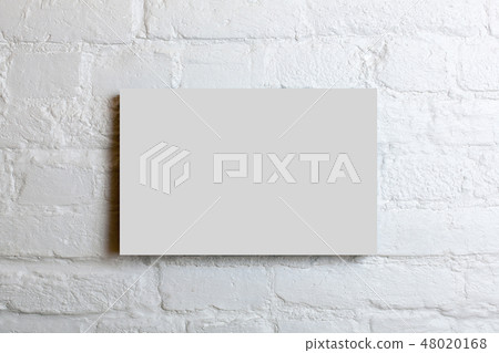 White blank poster in a white brick wall. 48020168