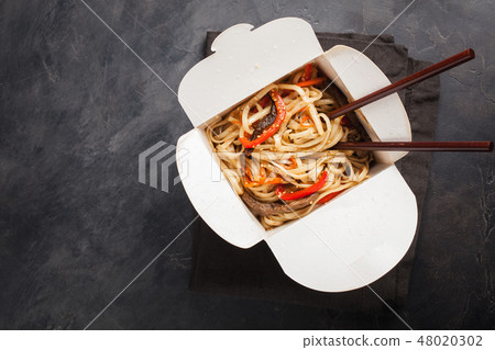noodles in a box with vegetables and beef. noodles in a box with vegetables and beef. 48020302