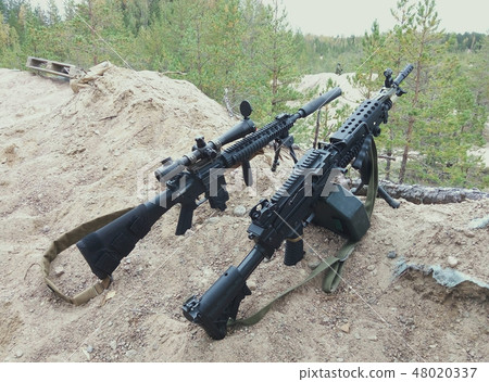 Assault rifle and machine gun. Assault rifle and machine gun. 48020337