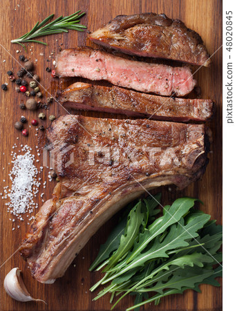 Grilled cowboy beef steak. Grilled cowboy beef steak. 48020845