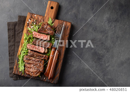 Closeup ready to eat steak new York. 48020851