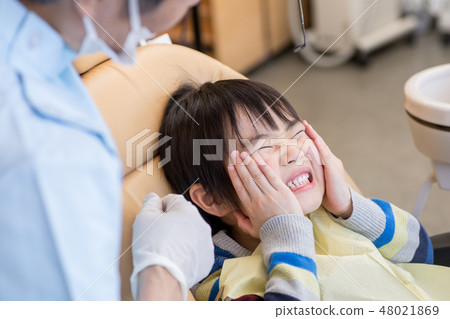 A boy with a toothache A boy with a toothache 48021869
