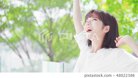 young woman feel carefree 48022386