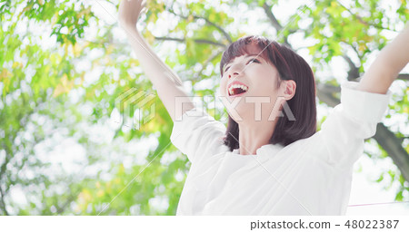 young woman feel carefree young woman feel carefree 48022387