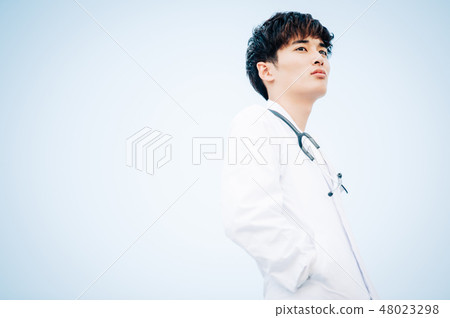Male in white coat standing on the roof 48023298