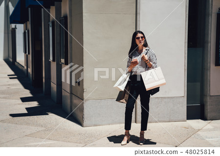 full length of young girl standing on corner 48025814