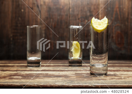 glasses with lemon 48028524