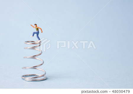 Boy dancing on spring 48030479