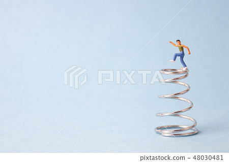 Boy dancing on spring Boy dancing on spring 48030481