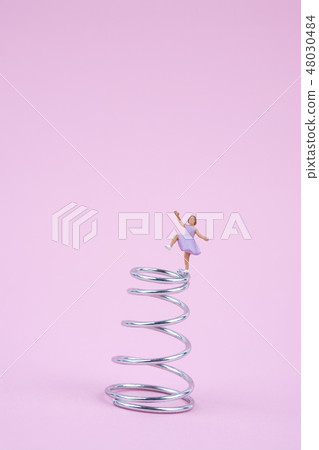 Girl dancing on a spring 48030484