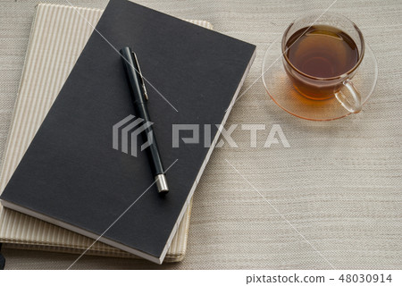 One glass note book and tea pen One glass note book and tea pen 48030914
