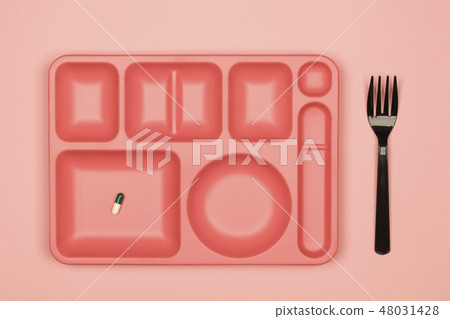 Coral tray with pills and fork Coral tray with pills and fork 48031428