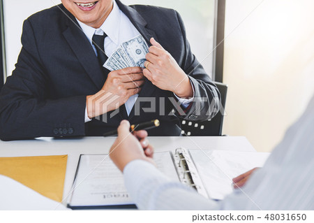 Bribery and corruption concept, bribe in the form of dollar bill 48031650