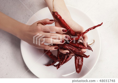 Beautiful female hand with red manicure 48031748