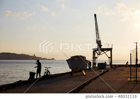 Lisbon old port at sunset 48032119
