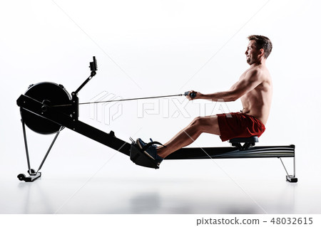 Man Using A Press Machine In A Fitness Club. Man Using A Press Machine In A Fitness Club. 48032615