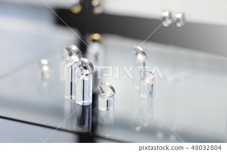 Luxury wedding rings in jeweler shop Luxury wedding rings in jeweler shop 48032804