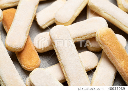 Italian Savoiardi ladyfingers Biscuits on concrete backgound Italian Savoiardi ladyfingers Biscuits on concrete backgound 48033089