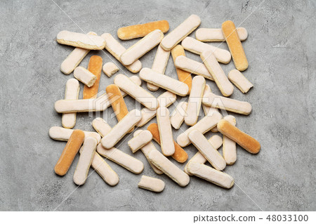 Italian Savoiardi ladyfingers Biscuits on concrete backgound 48033100