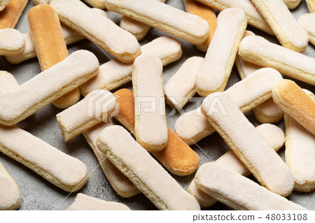 Italian Savoiardi ladyfingers Biscuits on concrete backgound Italian Savoiardi ladyfingers Biscuits on concrete backgound 48033108
