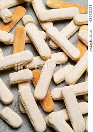 Italian Savoiardi ladyfingers Biscuits on concrete backgound Italian Savoiardi ladyfingers Biscuits on concrete backgound 48033121