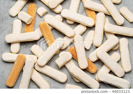 Italian Savoiardi ladyfingers Biscuits on concrete backgound Italian Savoiardi ladyfingers Biscuits on concrete backgound 48033123