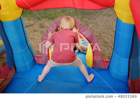 Charming little boy having fun in leisure center Charming little boy having fun in leisure center 48033169