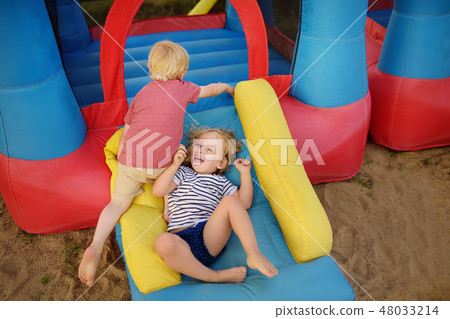 Little boy and girl having fun in leisure center Little boy and girl having fun in leisure center 48033214