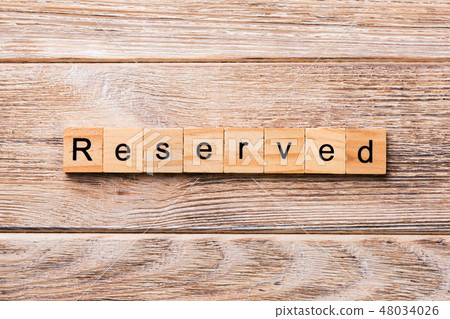 reserved word written on wood block.  48034026