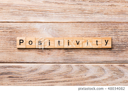 positivity word written on wood block positivity word written on wood block 48034082