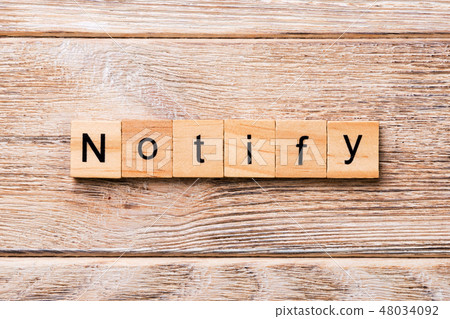 NOTIFY word written on wood block.  48034092