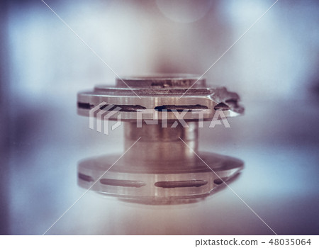 Selective Laser Melting. Object printed on metal 3d printer close-up. Selective Laser Melting. Object printed on metal 3d printer close-up. 48035064