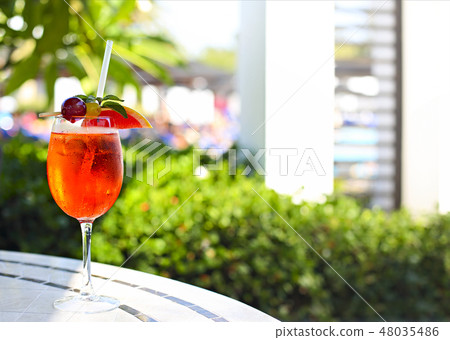 Glass of Aperol Spritz cocktail on the cafe table Glass of Aperol Spritz cocktail on the cafe table 48035486
