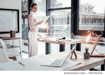 Ambitious fellow worker being satisfied when receiving positive feedbacks Ambitious fellow worker being satisfied when receiving positive feedbacks 48036343
