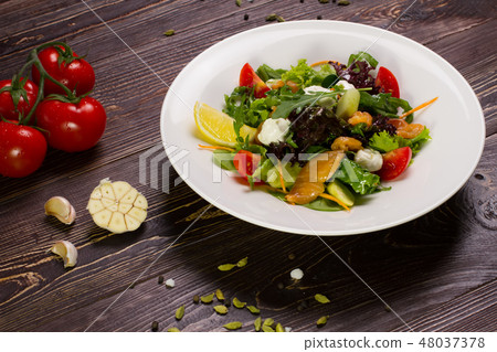 Appetizing salad with salmon. Appetizing salad with salmon. 48037378