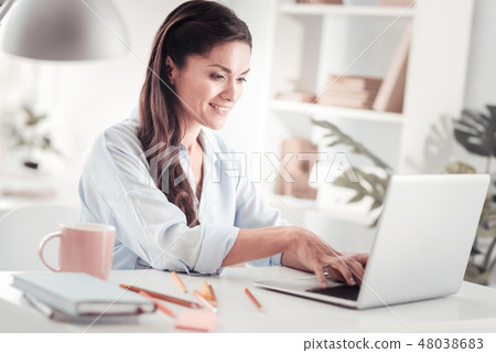 Young would-be entrepreneur writing business plan working at home 48038683