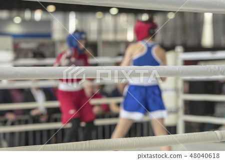 Blurred image of young athletes boxers in a ring boxing game 48040618