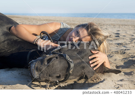 horsewoman on the beach 48041233