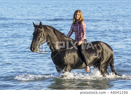horse woman in the sea 48041298