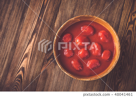 Bowl of canned tomatoes Bowl of canned tomatoes 48041461