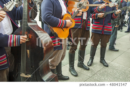 Croatian musicians in traditional costumes Croatian musicians in traditional costumes 48041547