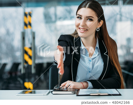 friendly hr portrait smiling intern welcoming hand friendly hr portrait smiling intern welcoming hand 48042166