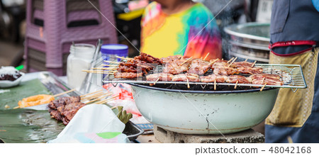 Thai Street Food Cuisine, Marinated Pork Skewers Thai Street Food Cuisine, Marinated Pork Skewers 48042168