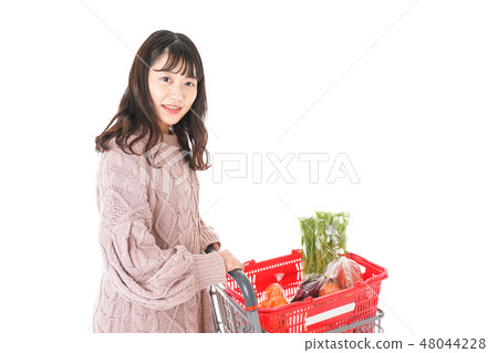 A young woman shopping at the supermarket A young woman shopping at the supermarket 48044228