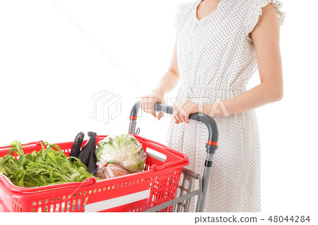 A young woman shopping at the supermarket A young woman shopping at the supermarket 48044284