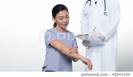 Asian Middle 60s age Woman Patient check up health with Doctor. Aging Society lady concern on healthcare diagnose Office syndrome backache with medical expertise, studio lighting isolated copy space Asian Middle 60s age Woman Patient check up health with Doctor. Aging Society lady concern on healthcare diagnose Office syndrome backache with medical expertise, studio lighting isolated copy space 48045394
